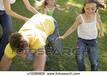Stock Photo - Family in park. Fotosearch