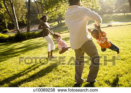 Stock Photo - Family in park. Fotosearch