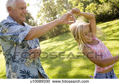 Grandfather and Granddaughter in park View Large Photo Image Stock Image - Grandfather and Granddaughter in park. Fotosearch