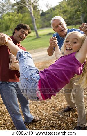 Grandfather, father and daughter in park View Large Photo Image Stock Image - Grandfather, father and daughter in park. Fotosearch