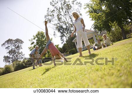 Grandparents and family in park View Large Photo Image Picture - Grandparents and family in park. Fotosearch