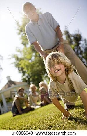 Grandparents and family in park View Large Photo Image Stock Image - Grandparents and family in park. Fotosearch
