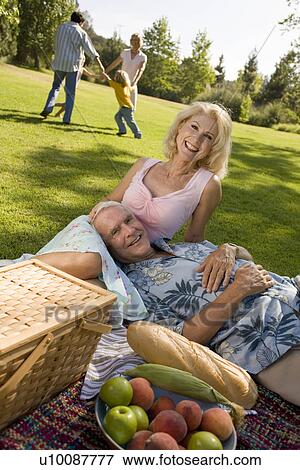 Grandparents and family in park View Large Photo Image Stock Photo - Grandparents and family in park. Fotosearch