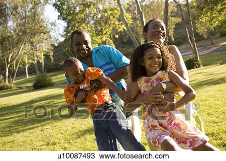 Grandparents and grandchildren in park View Large Photo Image Stock Image - Grandparents and grandchildren in park. Fotosearch