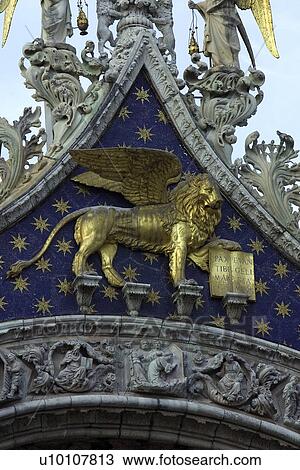 Gold winged lion on starred blue background of St Marks Basilica View Large Photo Image Stock Image - Gold winged lion on starred blue background of St Marks Basilica. Fotosearch