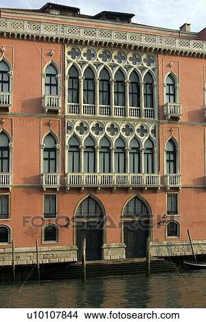 Picture - Palazzo on canal with waterside entrances and two floors of balconied arched windows.. Fotosearch