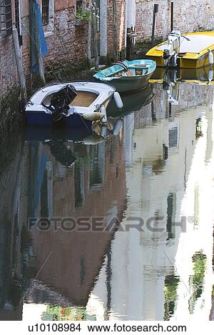 Building reflected in quite canal - boats moored at side View Large Photo Image Picture - Building reflected in quite canal - boats moored at side. Fotosearch