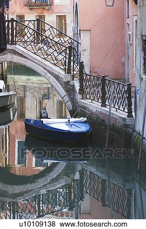 Stock Photo - Building reflected in quite canal. Fotosearch