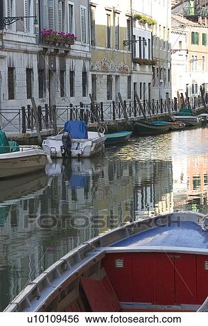 Building reflected in quite canal - boats moored at side View Large Photo Image Stock Photograph - Building reflected in quite canal - boats moored at side. Fotosearch