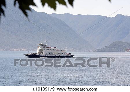 Car ferry on Lago di Como, hills in background View Large Photo Image Stock Photo - Car ferry on Lago di Como, hills in background. Fotosearch