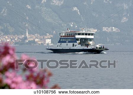 Car ferry on Lago di Como Italy hills and town in background, pink flowers in foreground View Large Photo Image Stock Photograph - Car ferry on Lago di Como Italy hills and town in background, pink flowers in foreground. Fotosearch