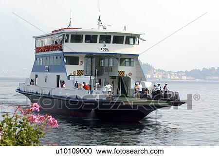 Stock Image - Car ferry on Lago di Como Italy arriving Mennagio hills in background. Fotosearch