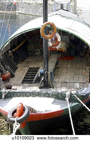 Stock Image - Fishing boat moored at Bellagio Lago do Como Northern Italy. Fotosearch