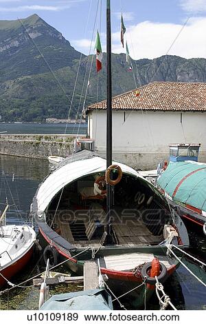 Stock Photo - Fishing boat moored at Bellagio Lago do Como Northern Italy. Fotosearch