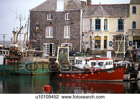 Stock Image - Fishing boats in Padstow harbour Southeast England. Fotosearch