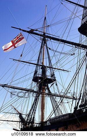 Stock Photo - HMS Victory Portsmouth England UK Mast and rigging detail with flag. Fotosearch