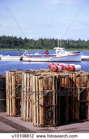 Lobster Pots and fishing boats Prince Edward Island View Large Photo Image Stock Image - Lobster Pots and fishing boats Prince Edward Island. Fotosearch
