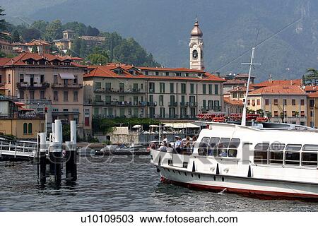 Stock Image - Menaggio-view of front and incoming boat. Fotosearch