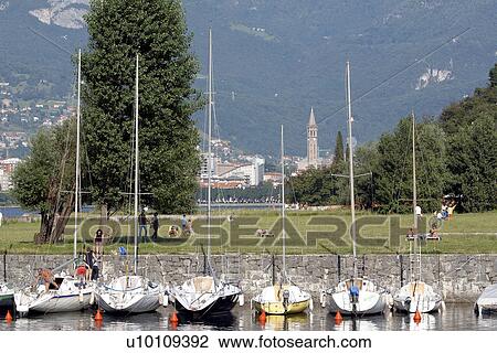 Stock Image - Sailboats in harbour Lago di Como Italy. Fotosearch