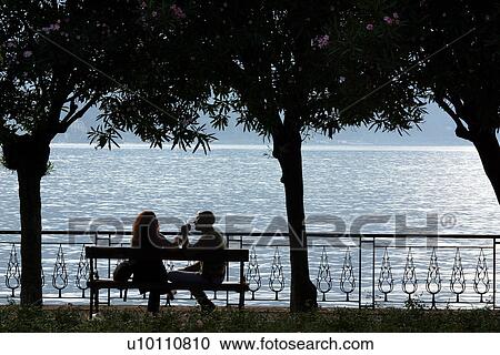 Stock Image - Bellagio-couple by lake. Fotosearch