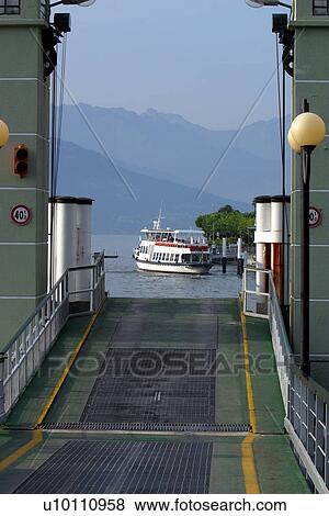 Stock Photo - Ferry leaving dock -Bellagio. Fotosearch