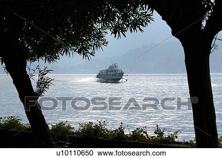 Hydrofoil at speed on Lago di Como, Mountains in background Italy View Large Photo Image Stock Image - Hydrofoil at speed on Lago di Como, Mountains in background Italy. Fotosearch