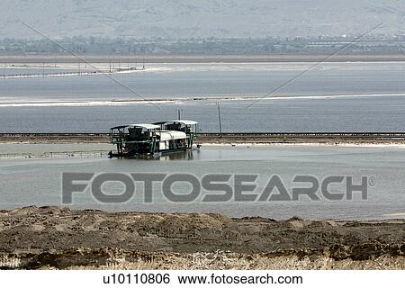 Stock Photograph - Salt extraction Barge on Dead Sea, Israel. Fotosearch