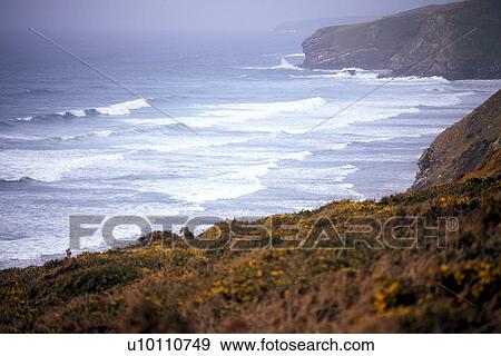 Stock Photo - Shoreline vistas with waves and mist Devon near Newquay England UK. Fotosearch