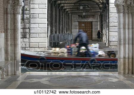 Stock Image - Delivery barge in motion. Fotosearch