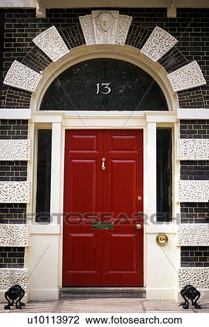 Stock Image - Bedford Square red door detail. Fotosearch