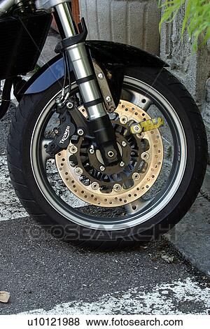 Front wheel of motor bike, brake detail View Large Photo Image Stock Photo - Front wheel of motor bike, brake detail. Fotosearch