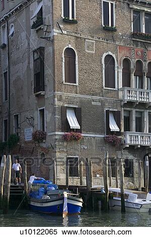 Stock Photography - Palazzo on Grand Canal with delivery barge in foreground.. Fotosearch