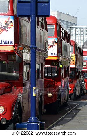 Stock Image - row of London double decker bus, red. Fotosearch