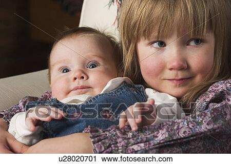 Stock Image - children, kids, dress, girls, siblings, sisters. Fotosearch