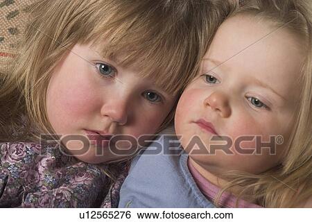 Stock Photograph - kids, dress, siblings, sisters, innocence, innocent. Fotosearch