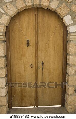 Stock Image - Close-Up, Doorknocker, Door, Day, Arch. Fotosearch