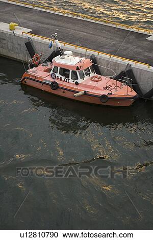 Stock Image - Boat, Docked, Dock, Anchored. Fotosearch