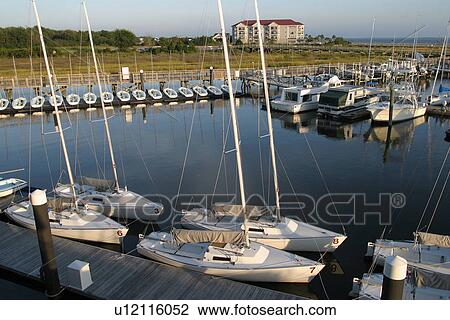 Stock Image - boats, parked, positioned, sun, dawn, dusk. Fotosearch