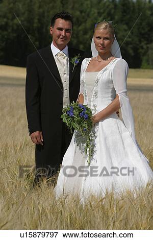 Stock Photo - woman, couple, gown, formal, function. Fotosearch