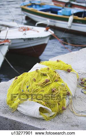 Stock Image - Boat, Coastal, Fishing Net, Interwoven, Knitted. Fotosearch