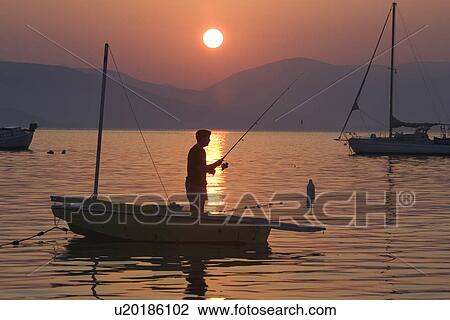 Stock Image - Boat, Dusk, Fishing, Recreational Pursuit, Fishing Rod. Fotosearch