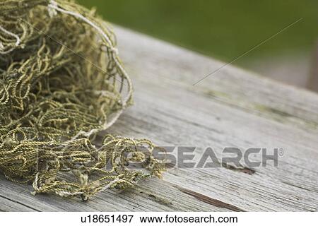 Stock Photo - Close-Up, Day, Fishing Equipment, Fishing Net, Focus On Foreground. Fotosearch