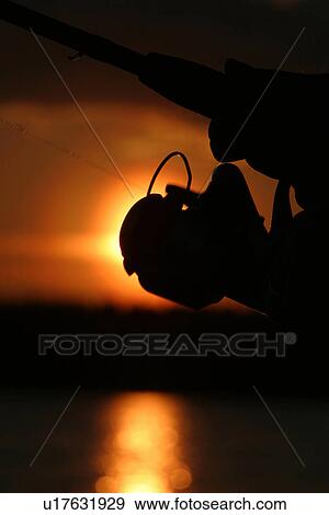Stock Photo - fishing reel, reel, line, nylon line, nature, natural. Fotosearch