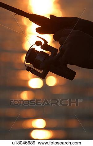 Stock Photo - fishing reel, reel, line, nylon line, nature, natural. Fotosearch