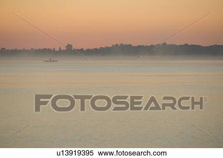 Stock Photography - Boat, Distant, Dusk, Fog. Fotosearch