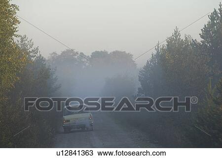 Stock Image - Car, Driver, Fog, Light. Fotosearch