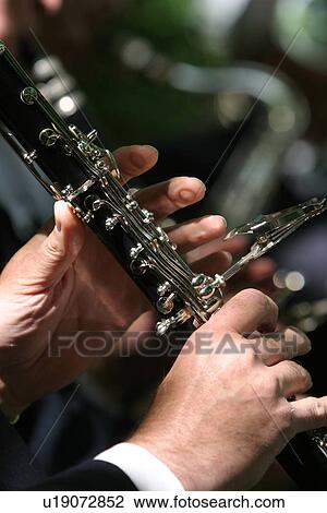 Brass Instrument, Hands, Equipment, Device, Accessory View Large Photo Image Stock Image - Brass Instrument, Hands, Equipment, Device, Accessory. Fotosearch