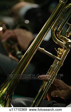 Stock Photo - horn, hands, music, device, harmonious, accessory. Fotosearch