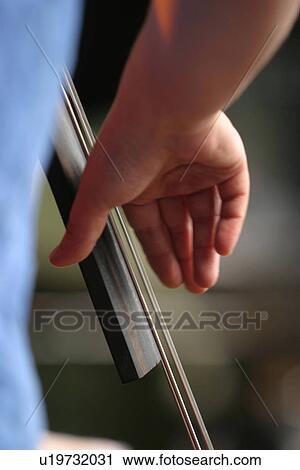 Stock Image - musical, instrument, work, cello, musician, instrumentalist. Fotosearch