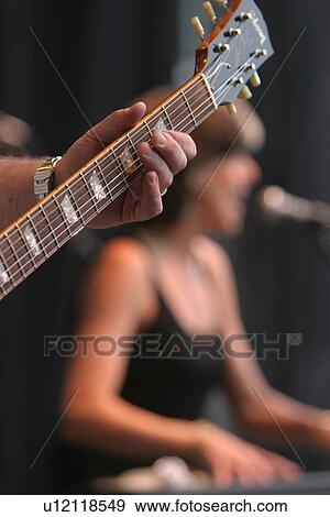 Stock Photo - performance, performing, band, musical, instrument, work. Fotosearch
